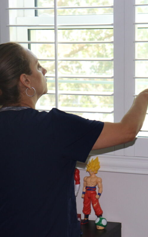 worker cleaning dust on a deep cleaning service with Legacy Cleaning